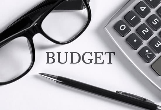 Budget sing, glasses, pen, calculator